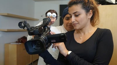 Khuloud Al Ali (holding puppet) making her film at La Fémis film school in France. Courtesy Khuloud Al Ali