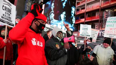 Staten Island Amazon workers protest in Times Square as they demand union rights in New York City. Reuters