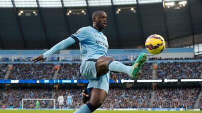 Ivorian midfielder Yaya Toure is an icon in the blue half of Manchester. Oli Scarff / AFP