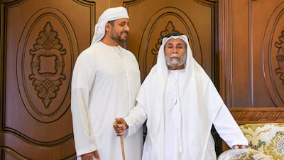Father and son: Mohamed Buti Al Mazrouei, and Mr Al Mazrouei, at their home in Al Ain.