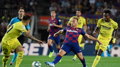 Barcelona's Brazilian midfielder Arthur vies with Villarreal's Spanish midfielder Ruben Pena. AFP