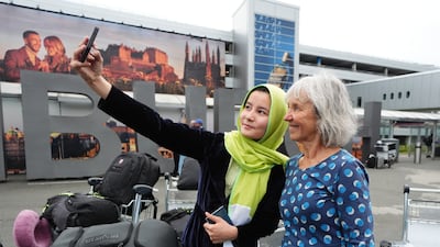 Lorna Norgrove, mother of aid worker Linda Norgrove, with a student at Edinburgh Airport. The family foundation’s primary goal is to help women and children in Afghanistan