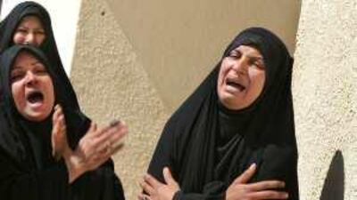 Sisters of Fayha Kadim, 23, who with her son Muntadhar Waleed, 3, was killed in Baghdad on Sunday, grieve at their funeral in Najaf.