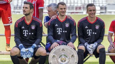 Sven Ulreich sits next to Manuel Neuer during a Bayern Munich team photo call prior to the start of the 2017/18 season. Guenter Schiffmann / AFP