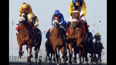 Mickdaam ridden by Christophe Soumillon and trained by Mike de Koch charges the wire to win the 2nd race at Meydan. Mike Young / The National