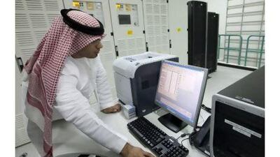 An employee monitors data at Etisalat's internet submarine cable landing facilities in Fujairah.