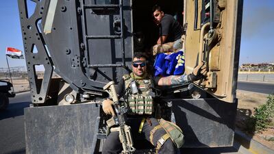 Iraqi security forces members are seen inside a military vehicle as they advance in Kirkuk, Iraq October 16, 2017. REUTERS/Stringer NO RESALES. NO ARCHIVES