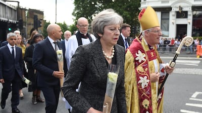 Britain's prime minister Theresa May walks to London Bridge to lay flowers at the scene of the attack. EPA/FACUNDO ARRIZABALAGA
