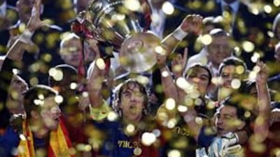 Barcelona captain Carles Puyol lifts the Champions League trophy on Wednesday night at the Stadio Olimpico in Rome.