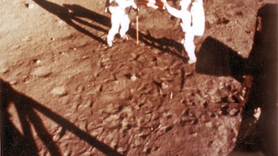 On July 20, 1969, US astronauts Neil Armstrong and Buzz Aldrin place the US flag on the lunar surface during the Apollo 11 lunar landing mission - becoming the first humans to land on the Moon. Mr Armstrong was the first one to step foot on the surface