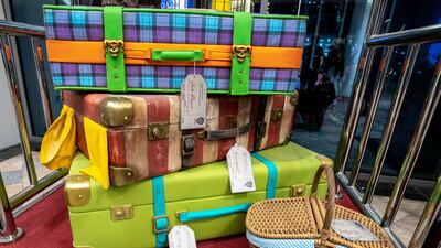 Luggage belonging to Warner Bros' characters sit on a trolley at the front of the hotel. Victor Besa / The National
