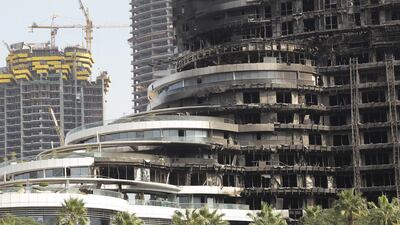 The aftermath of the Address Downtown Hotel in which half of the edifice was gutted by a fire on New Year's Eve. Jeffrey E Biteng / The National