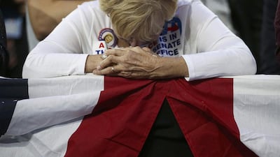 A supporter of Democratic presidential nominee Hillary Clinton bows her head at an election night rally in New York. Carlos Barria / Reuters