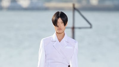 Peter Do opened his debut runway show with an understated trench coat. Photo: Peter Do