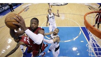Miami Heat's Dwyane Wade goes up for a shot during the second half of Game 3.