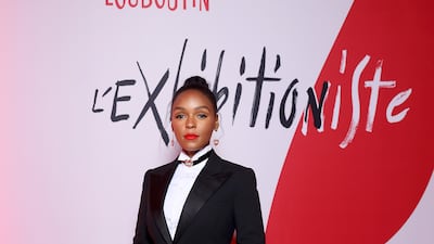 Janelle Monae, wearing a Ralph Lauren tuxedo and Christian Louboutin Gael Strass suede boots, attends a Christian Louboutin exhibition in Paris on February 24, 2020. Getty Images