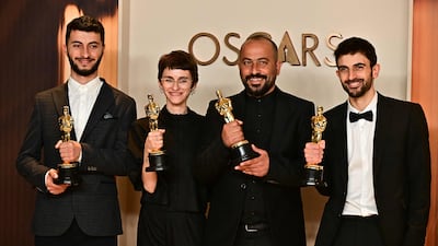Israeli filmmakers Yuval Abraham, right, and Rachel Szor, second from left, reunite for a new documentary premiering at the Venice Film Festival. AFP