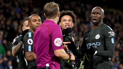 Fernandinho, left of the referee, Leroy Sane, right of the referee, may in trouble. Shaun Botterill / Getty Images