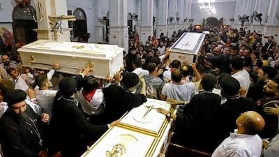 Coffins of those killed in the fire in the densely populated Imbaba working class district west of the Nile River. AFP