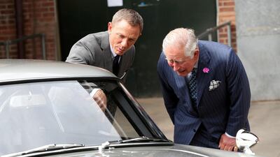 While on set, Prince Charles had a good look at the automotive props. Reuters