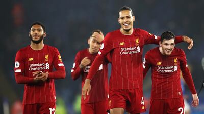 Liverpool's Virgil van Dijk and Andrew Robertson, right, after the win at The King Power Stadium. PA
