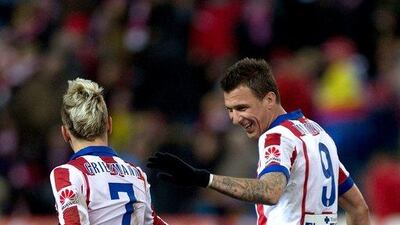 Antoine Griezmann and Mario Mandzukic of Atletico Madrid shown during their La Liga win over Almeria on Saturday. Gonzalo Arroyo Moreno / Getty Images / February 21, 2015