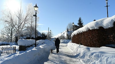 A man walks his dog through Braemar. Getty Images