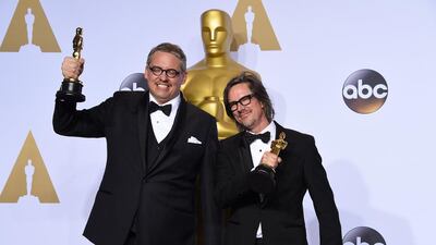 Adam McKay, left, and Charles Randolph pose with the award for best adapted screenplay for The Big Short in the press room at the Oscars on Sunday, Feb. 28, 2016, at the Dolby Theatre in Los Angeles. Frederic J Brown / AFP photo