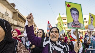 Syrian Kurds demonstrate against the Turkish assault against northeastern Syria, in the town of Qamishli. AFP