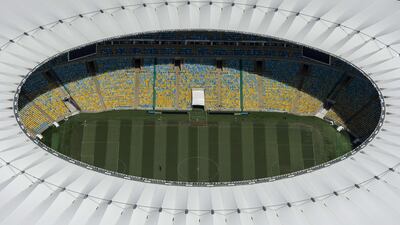 Aerial view of the Mario Filho (Maracana) stadium in Rio de Janeiro, Brazil, on December 3, 2013. The Maracana stadium will host the Brazil 2014 FIFA World Cup and the 2016 Summer Olympics. AFP PHOTO / YASUYOSHI CHIBA JAPAN OUT *** Local Caption *** 475188-01-08.jpg
