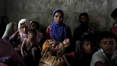 Newly arrived Rohingya refugee and mother of eight Shalida Begum, 25, sits in a school room as the wait to be transferred to a camp in Cox's Bazar, Bangladesh, October 2, 2017. Begum said she travelled with her family through the forests of Myanmar for forty days after her house was burned by soldiers.