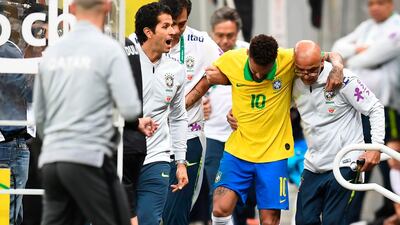 Brazil's Neymar leaves the pitch injured during a friendly football match against Qatar at the Mane Garrincha stadium in Brasilia on June 5, 2019. The Brazil captain was later ruled out of the tournament. AFP