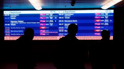 A passenger-information screen at Madrid's Atocha station shows cancelled trains following the crash near Urda, as drivers' union Semaf starts a 24-hour strike. EPA