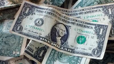 FILE - This Oct. 24, 2016 file photo shows dollar bills in New York. Yes, money matters are personal, but don’t be embarrassed or reticent. The more details you give, including dreams, regrets and mistakes, the more a financial planner can do to help you reach your financial goals. (AP Photo/Mark Lennihan, File)