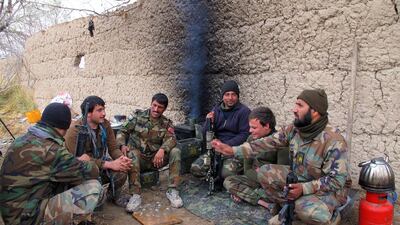 Members of the Afghan security forces rest during an operation against Taliban fighters in Nad Ali district of Helmand province, Afghanistan in December 2015. The Taliban seized control of the Sangin district in southern Helmand province in late December. Watan Yar/EPA