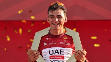 Race winner and UAE Team Emirates rider Isaac del Toro Romero celebrates on the podium after the seventh and final stage of the UAE Tour cycling event from Zayed National Museum to Abu Dhabi Breakwater in Abu Dhabi on February 22, 2026. (Photo by Fadel SENNA / AFP)