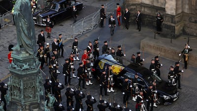 The hearse carrying the coffin of Queen Elizabeth II arrives at St Giles' Cathedral, Edinburgh, for a service of prayer and reflection.