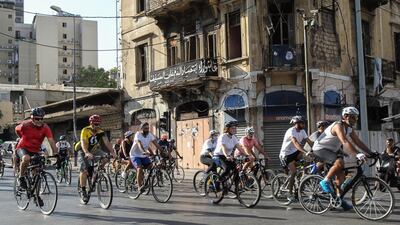 People take part in the 'Bike for Beirut' charity ride in Beirut. EPA