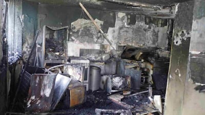 The scene found by firefighters inside the kitchen in flat 16 where the fire started. Grenfell Tower Inquiry via AP
