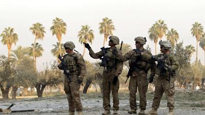 US troops keep watch at the site of a suicide attack on the outskirts of Jalalabad. A suicide attacker targeted a US convoy on the outskirts of Jalalabad on Monday but so far no causalities have been reported yet, provincial spokesman Ahmadzia Abdulzai said. Parwiz / Reuters