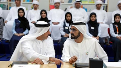 Sheikh Mohammed bin Rashid, Prime Minister and Ruler of Dubai, confers with Sheikh Saif bin Zayed, Deputy Prime Minister and Minister of the Interior, at the Cabinet meeting at the Fatima bint Mubarak School in Ras Al Khaimah.