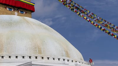 A decorator on the Boudhanath Stupa, a vast domed Buddhist monument, in Kathmandu, Nepal. EPA