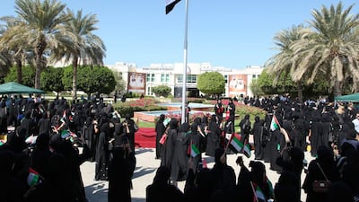 Abu Dhabi Women’s College students raise the flag with pride.