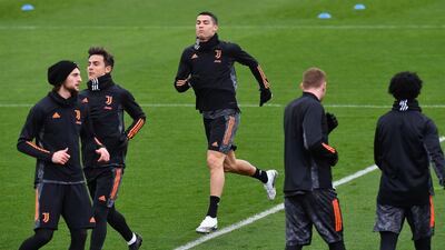 Adrien Rabiot, Paulo Dybala and Cristiano Ronaldo train ahead of the Champions League match against Barcelona. AFP