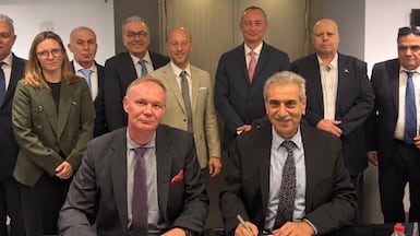 Ali Shaath, head of the National Committee for the Administration of Gaza, right, and Alexander Zschocke, GIZ country director, sign the assistance agreement in Cairo on Tuesday. Photo: NCAG / X