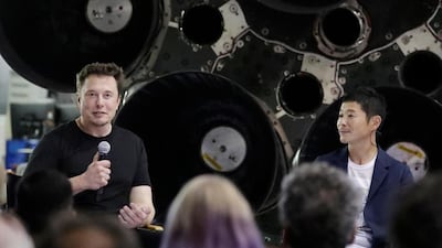 SpaceX founder Elon Musk (L), introduces Japanese billionaire Yusaku Maezawa as the first private passenger on a trip around the moon, in September 2018. AP