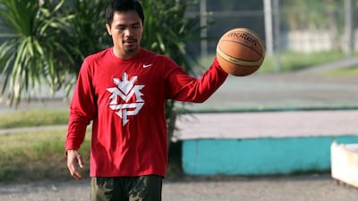 Filipino boxing icon Manny Pacquiao, is, like many of his countrymen, a noted basketball fan. Jeffrey Maitem / Getty Images