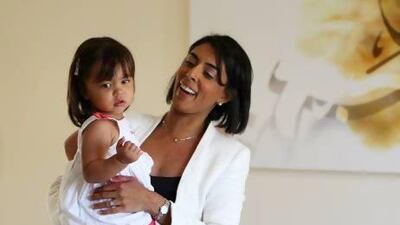 Ambareen Musa, founder of Souqalmal.com, with her daughter Rania, whose future education is in very safe hands. Pawan Singh / The National