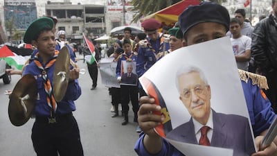 Palestinian scouts hold posters of Mahmoud Abbas during a Fatah rally in support of the Palestinian president in Nablus on April 2, 2014. Abed Omar Qusini / Reuters