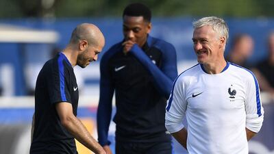 Didier Deschamps, right, has warned against his France side taking their Group A rivals lightly. Franck Fife / AFP